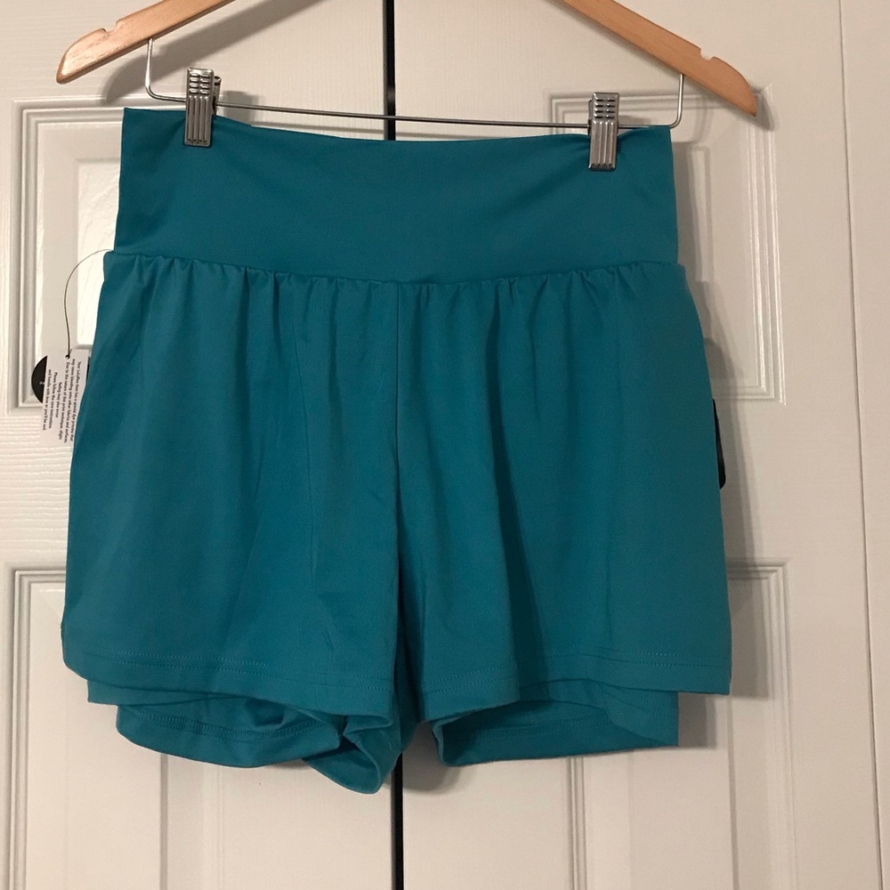 LuLaRoe Unbeatable workout shorts Turquoise size Large NWT